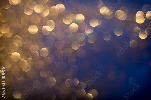 Golden and silver glitter backgound with bokeh abstract effect