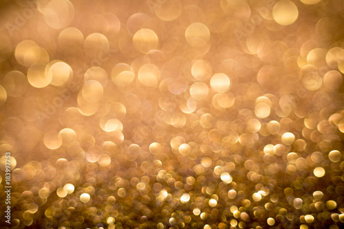Golden and silver glitter backgound with bokeh abstract effect