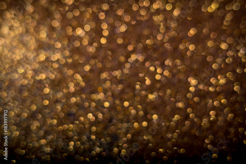 Golden and silver glitter backgound with bokeh abstract effect