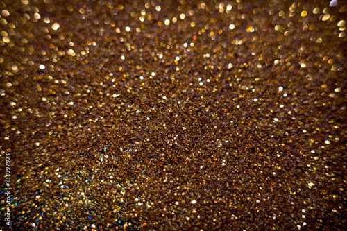 Golden and silver glitter backgound with bokeh abstract effect