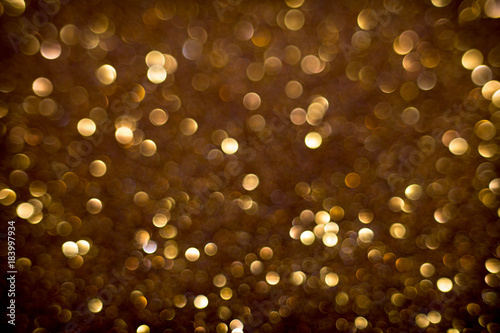 Golden and silver glitter backgound with bokeh abstract effect