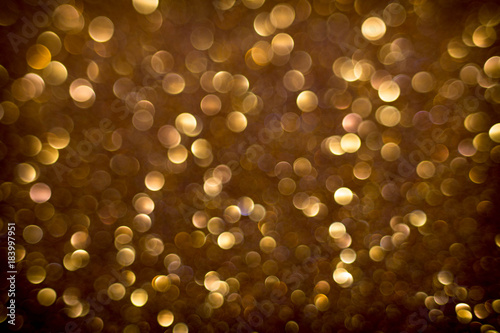 Golden and silver glitter backgound with bokeh abstract effect