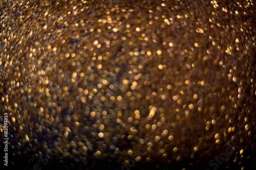 Golden and silver glitter backgound with bokeh abstract effect