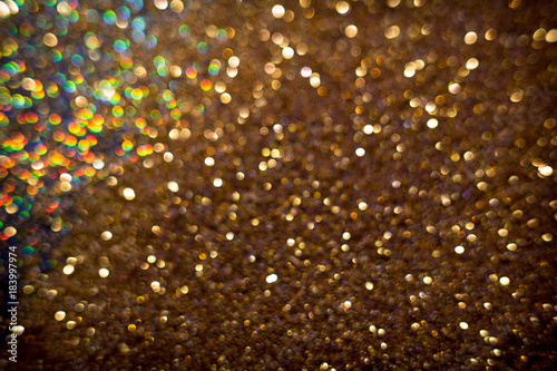 Golden and silver glitter backgound with bokeh abstract effect