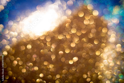 Golden and silver glitter backgound with bokeh abstract effect