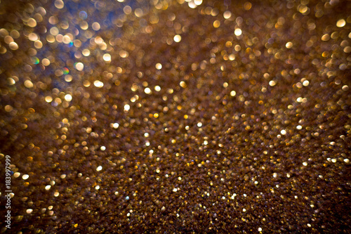 Golden and silver glitter backgound with bokeh abstract effect