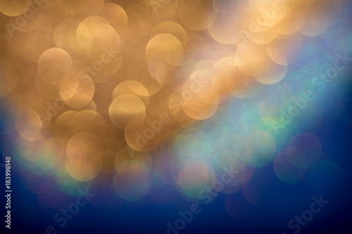 Golden and silver glitter backgound with bokeh abstract effect