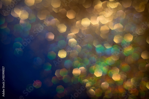 Golden and silver glitter backgound with bokeh abstract effect