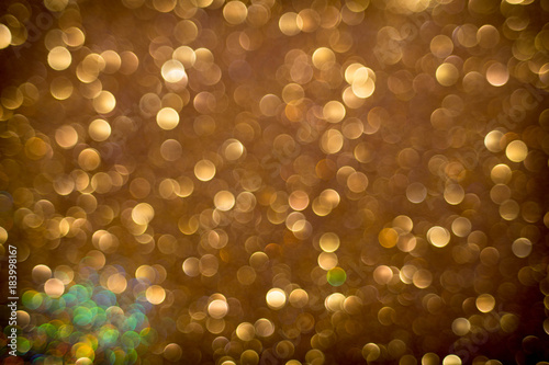 Golden and silver glitter backgound with bokeh abstract effect