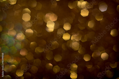 Golden and silver glitter backgound with bokeh abstract effect