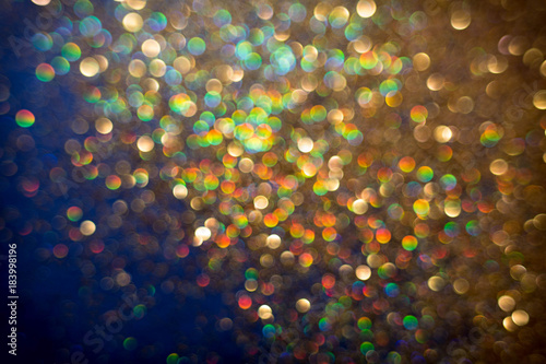 Golden and silver glitter backgound with bokeh abstract effect