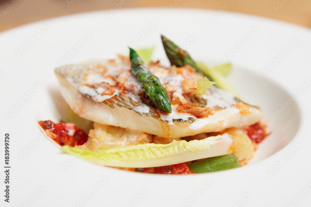 Grilled fish with asparagus in plate Grilled fish with asparagus in plate