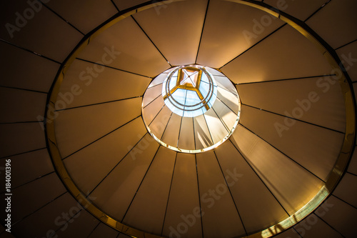buliding roof circle, light through from above, background
