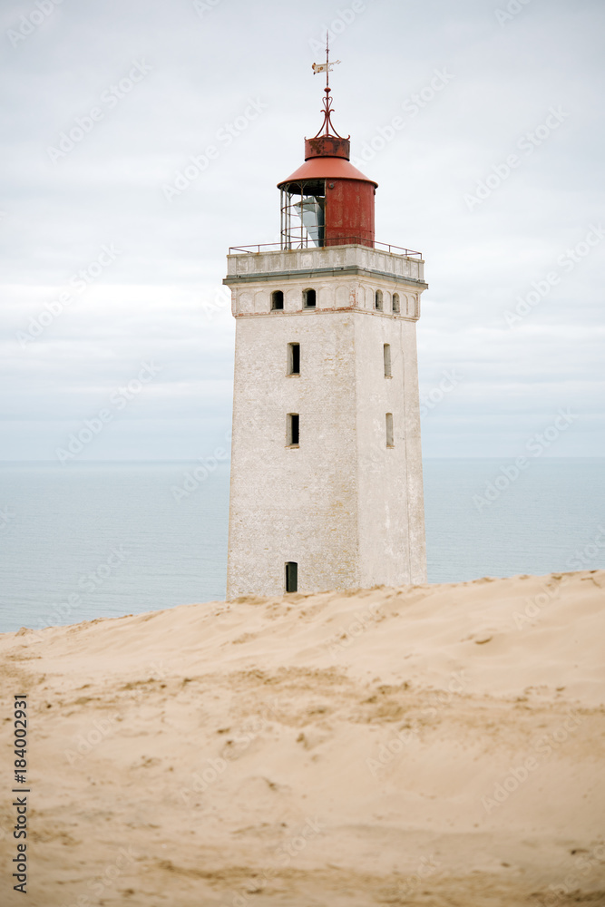 Lighthouse Rubjerg Knude and sand dunes at the danish North Sea coast, Denmark, Europe