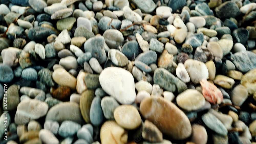 Walking on stone pebble beach. Background of seacoast 4K Walking on stone pebble beach. Background of seacoast 4K