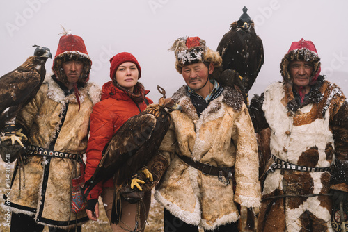 Tourist with Eagle Hunters photo