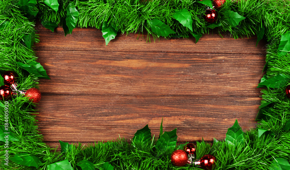 bright wooden festive background with branches of a Christmas tree bright wooden festive background with branches of a Christmas tree