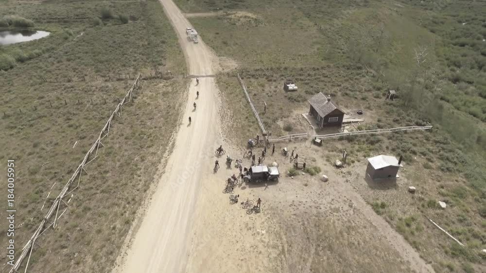 Cyclists stop at rest stop in rural landscape, aerial Cyclists stop at rest stop in rural landscape, aerial