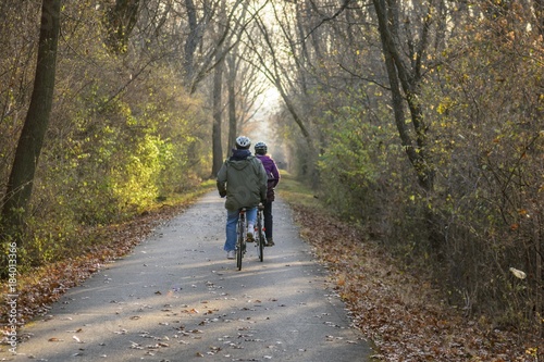 couple enjoying a peaceful ride in the woods on bicycles