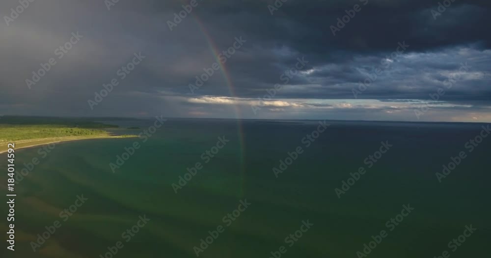 Flying towards a Rainbow Reflecting into a Lake Flying towards a Rainbow Reflecting into a Lake