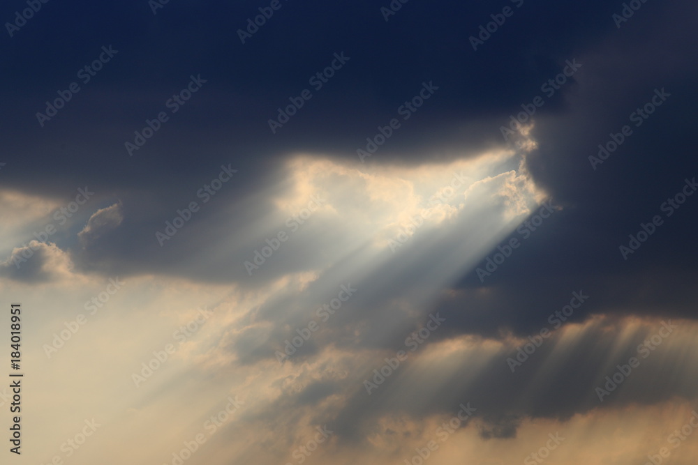 sky with clouds and dramatic god light.