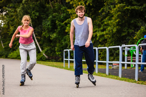 Active young people friends rollerskating.