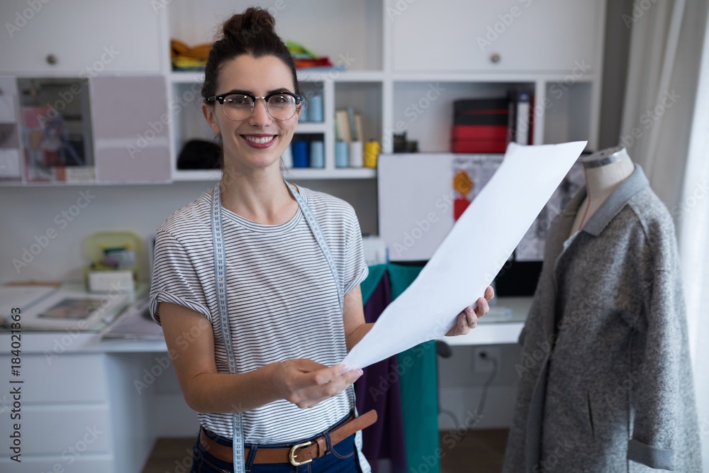 Fototapeta premium Fashion designer holding a document