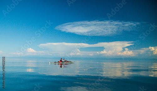 Mеn kayaking on Lake Baikal. Landscape. Siberia.