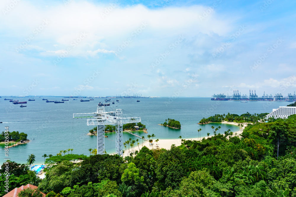 panorama landscape view of singapore sea and siloso beach with blue sky and cloud, POV from cable car.