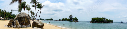 beautiful panorama view of siloso beach and sea at sentosa island  singapore with blue sky and cloud.