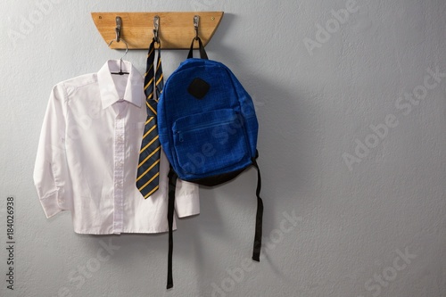 Obraz na płótnie School uniform and schoolbag hanging on hook