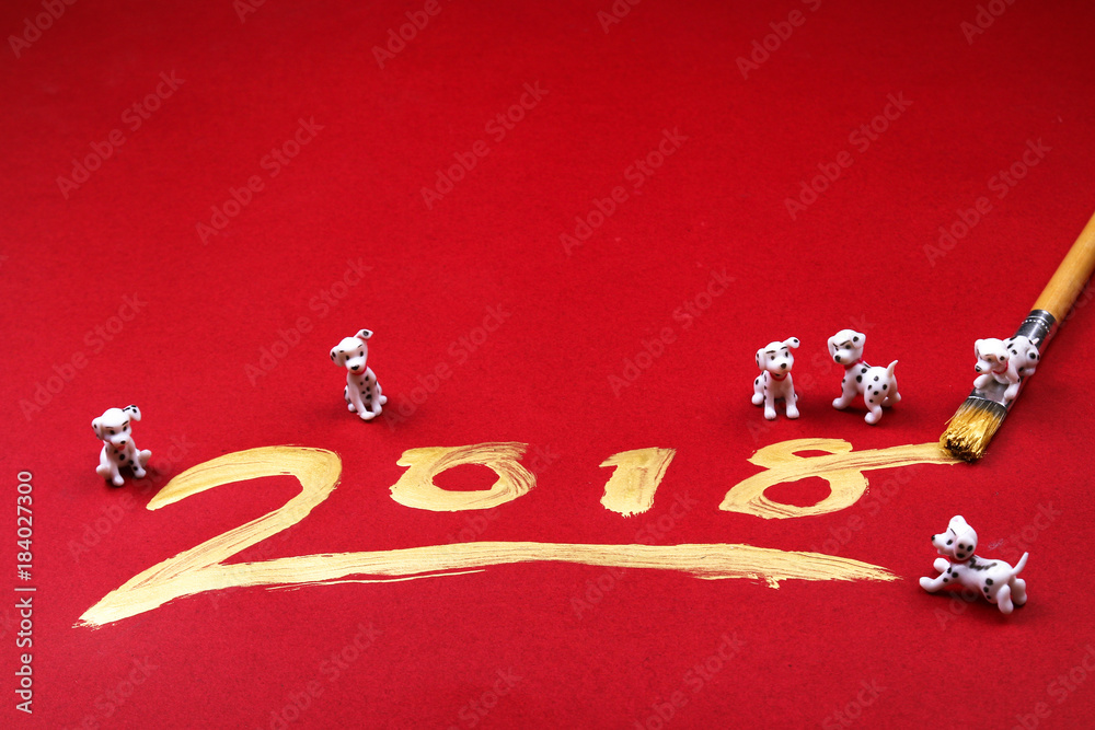 Miniature dogs with 2018 written in gold.  2018 is the year of the dog according to chinese zodiac calendar.