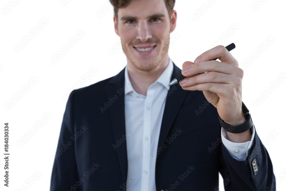 Businessman writing on an invisible screen Businessman writing on an invisible screen