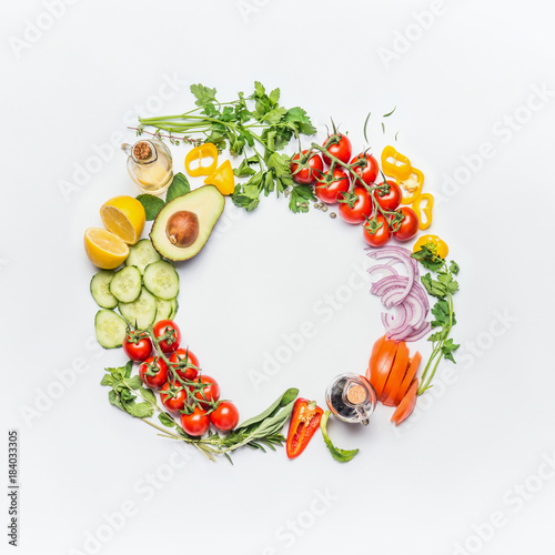 Healthy clean eating layout  vegetarian food and diet nutrition concept. Various fresh vegetables ingredients for salad on white table background  top view  round frame
