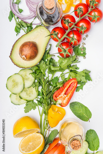 Fototapeta Naklejka Na Ścianę i Meble -  Healthy clean eating layout, vegetarian food and diet nutrition concept. Various fresh vegetables ingredients for salad on white table background, top view, close up