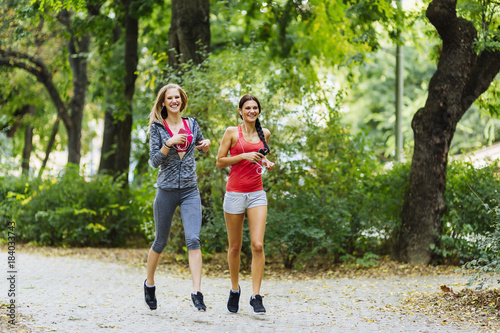 Athletic women jogging in nature
