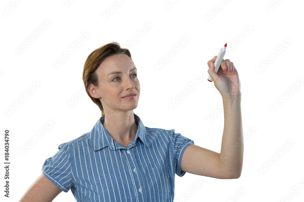 Female executive writing on invisible screen Female executive writing on invisible screen