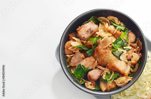 Thai Cuisine , Herb bergamot fried with pork part neck grill on grey background