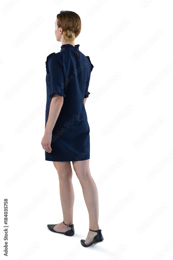 Female executive walking against white background Female executive walking against white background