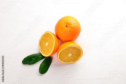 Orange on a wooden background. Top view. Free space for text.