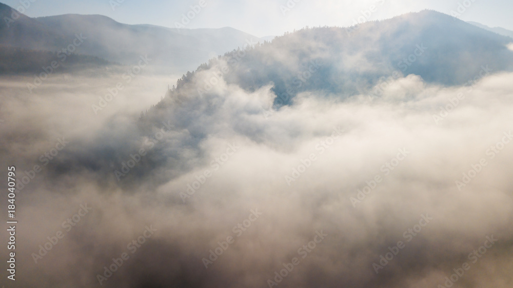 Aerial view of the mountains with a morning fog Aerial view of the mountains with a morning fog