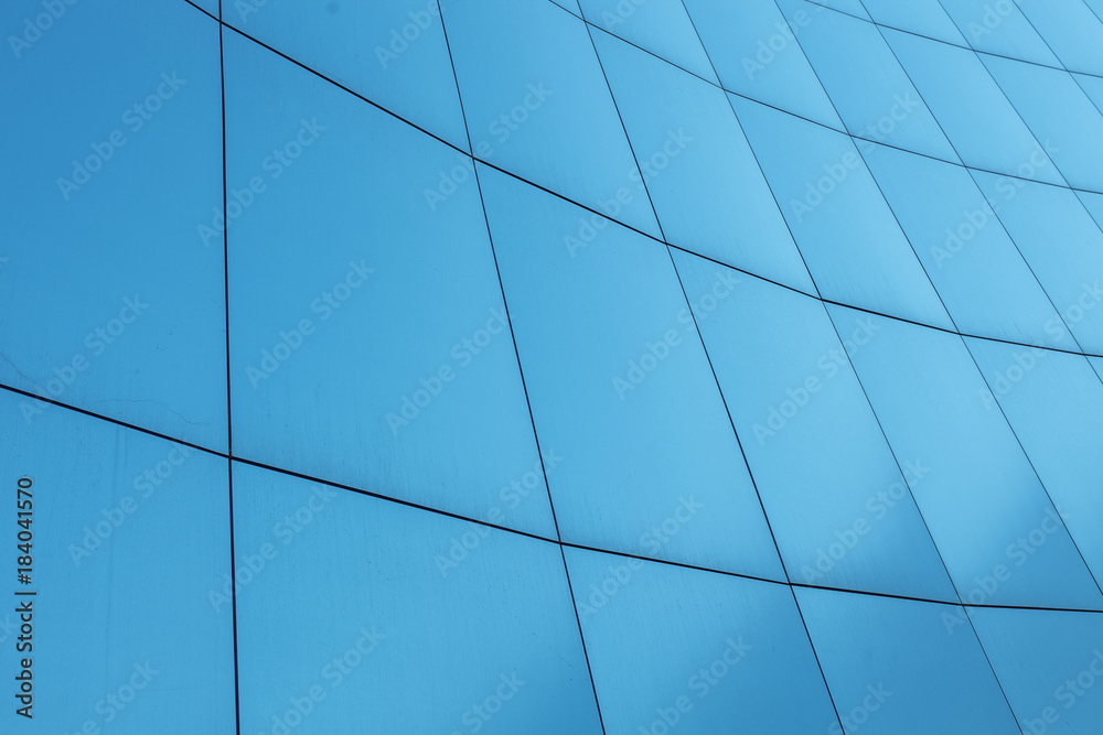 Fototapeta premium Blue background, business building with the lines on the walls.