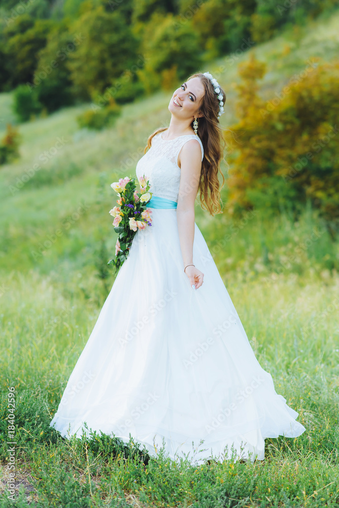 bride posing for the photographer on the nature bride posing for the photographer on the nature