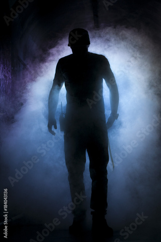 Silhouette of a man in fog light