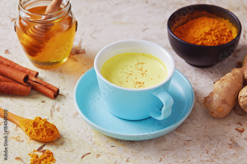 Delicious detox drink made of turmeric, ginger, milk, honey and cinnamon.