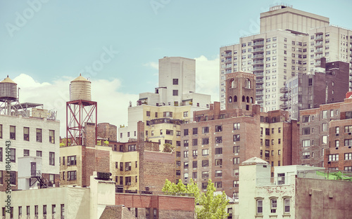 Old residential buildings in New York City, color toned picture, USA.