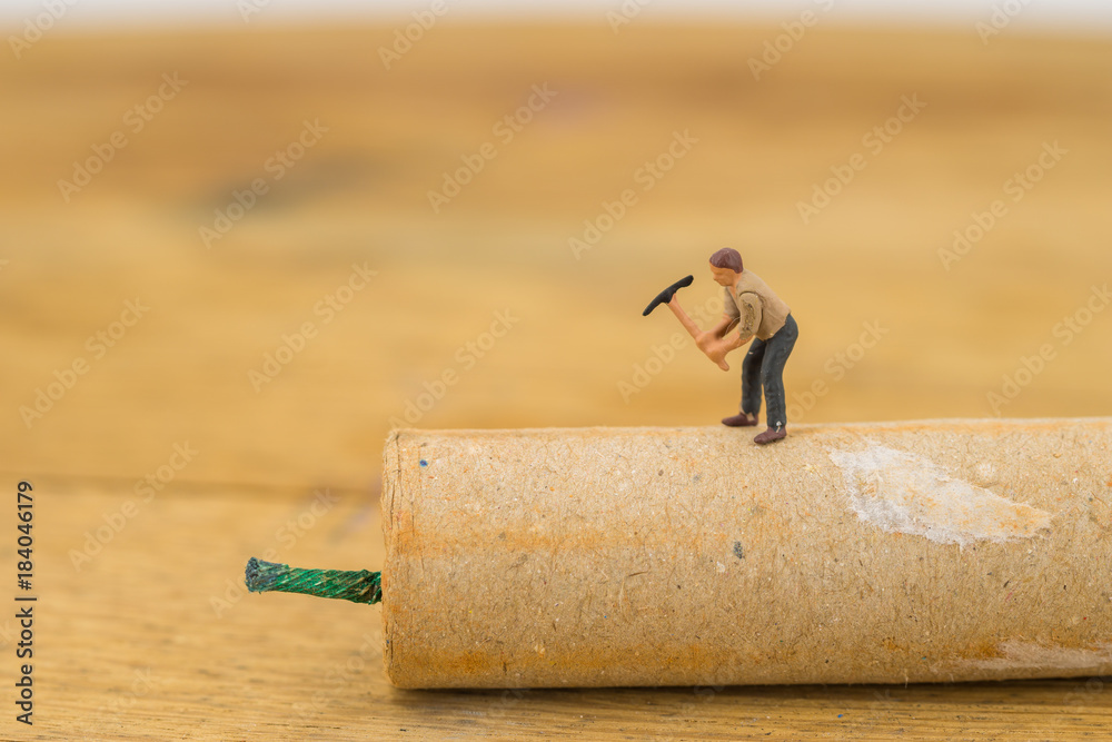 Concept miniature people destroying a Firecracker Concept miniature people destroying a Firecracker