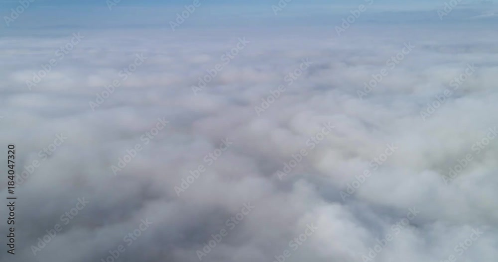 Aerial wiev: Amazing Flying over the Clouds of Fog, above the City Aerial wiev: Amazing Flying over the Clouds of Fog, above the City