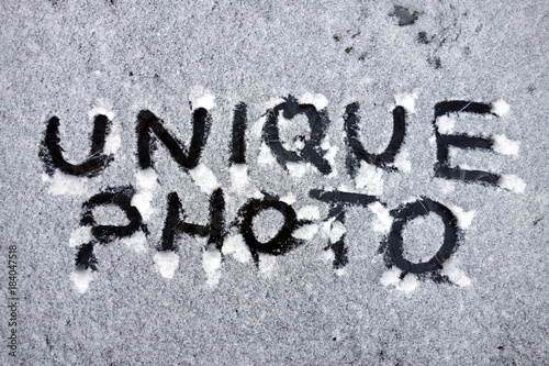 Unique photo words handwritten in snow 