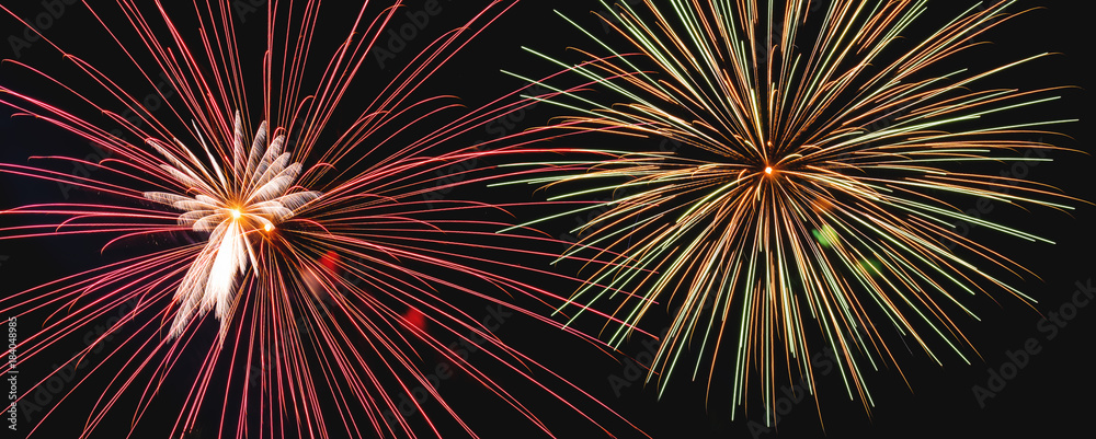 Obraz premium Panoramic Close-up Colorful Fireworks at Night, on black background